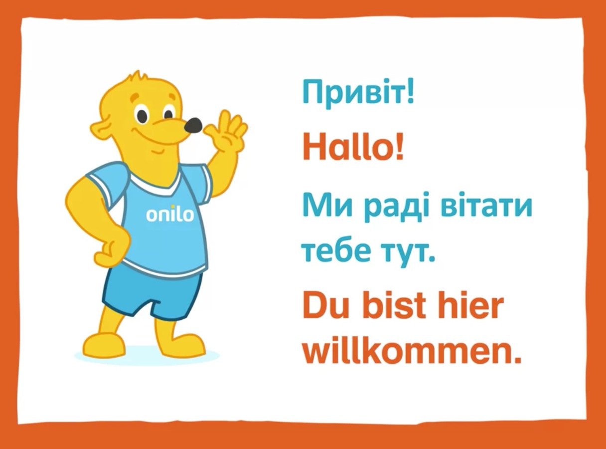 Der Onilo-Bär mit kurzenSätzen auf ukrainisch, russisch und deutsch.